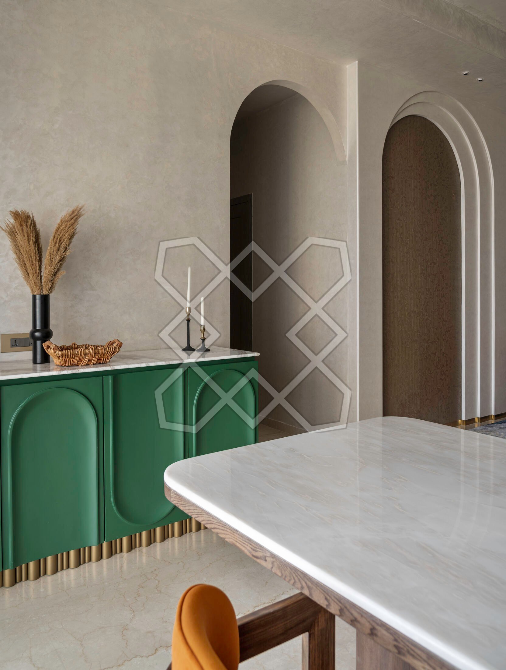 The green sideboard beside the dining table at Piramal Avyan