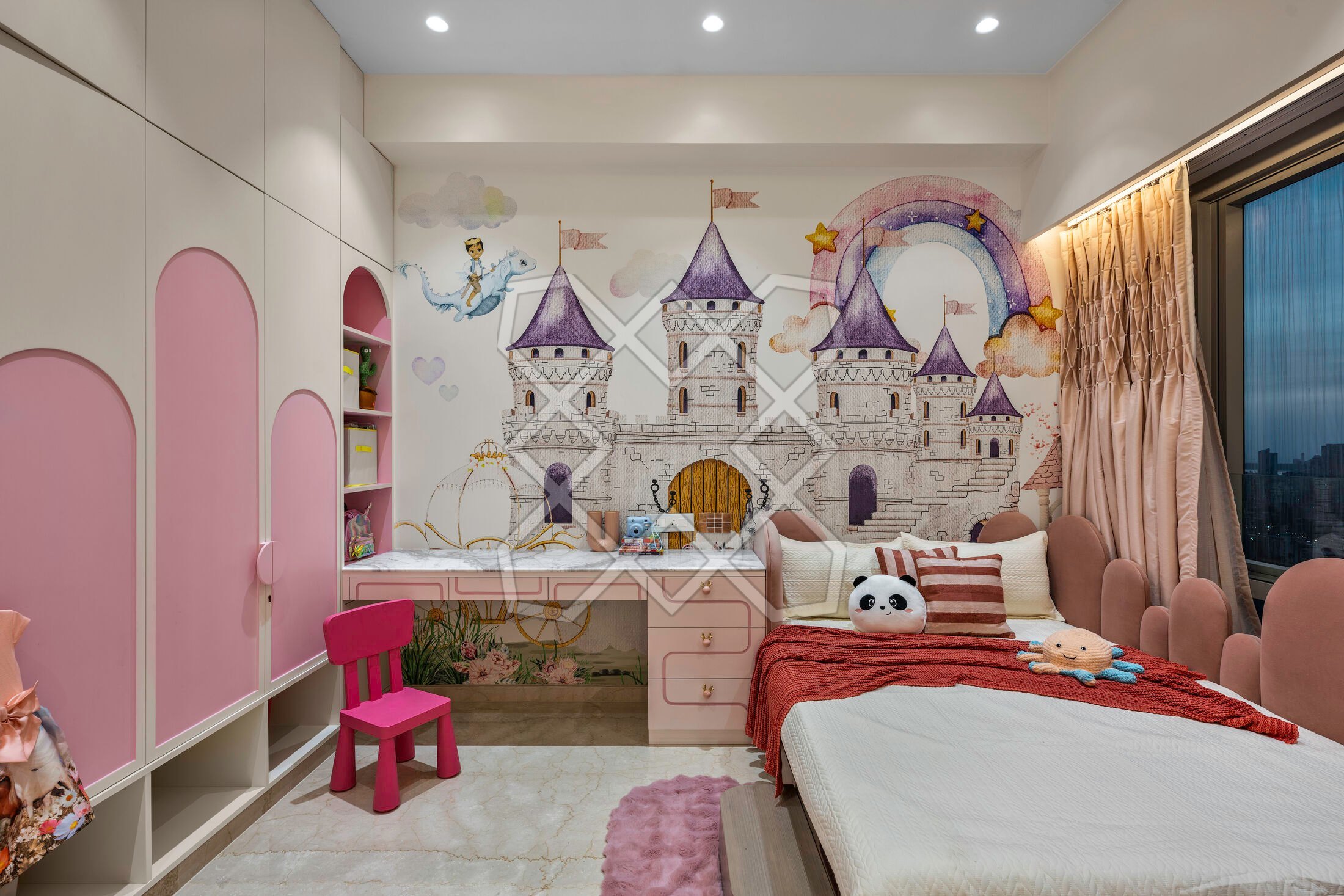 The daughter's room at Piramal Avyan, with its castle mural and pink arched wardrobes
