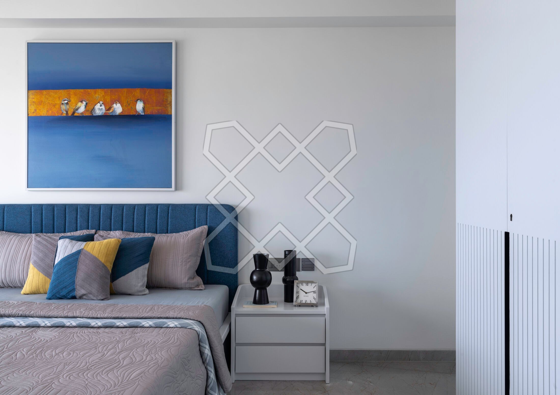The guest bedroom at the Juhu apartment, in blue and white