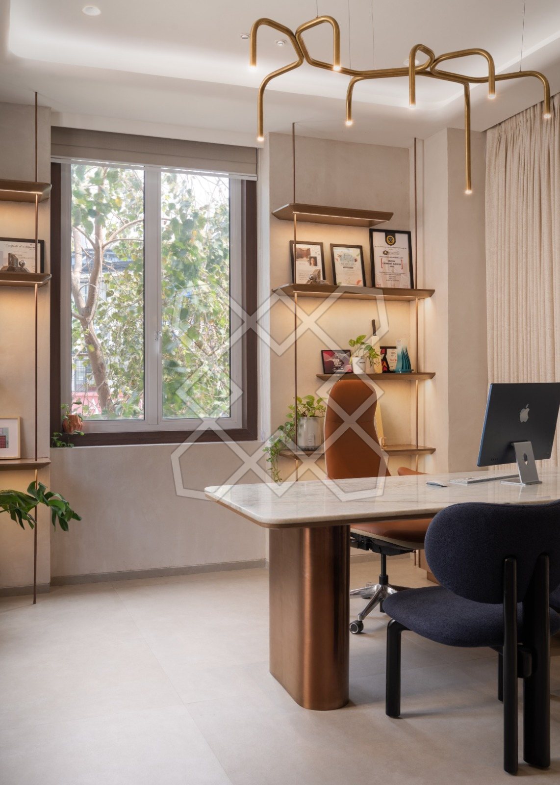 Aditi Savani's cabin at The Genesis, with its stone desk and open shelving