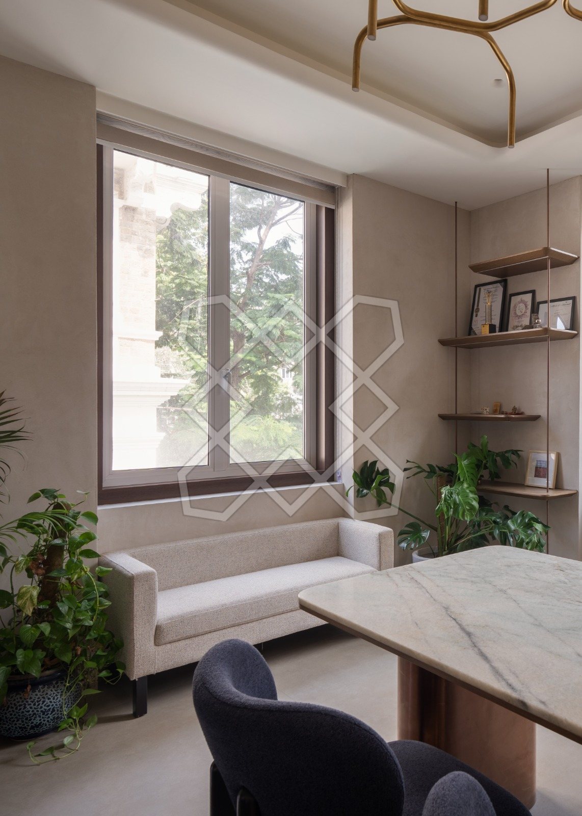 The lounge end of a cabin at The Genesis, in lime wash and light timber