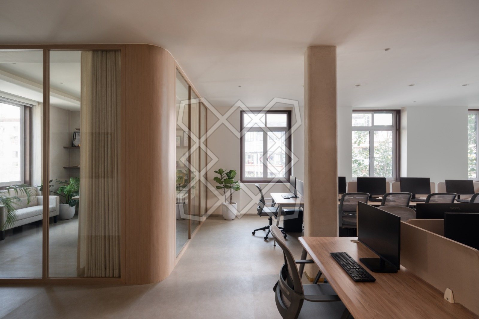 The main workspace at The Genesis, seen through its glass and timber partitions