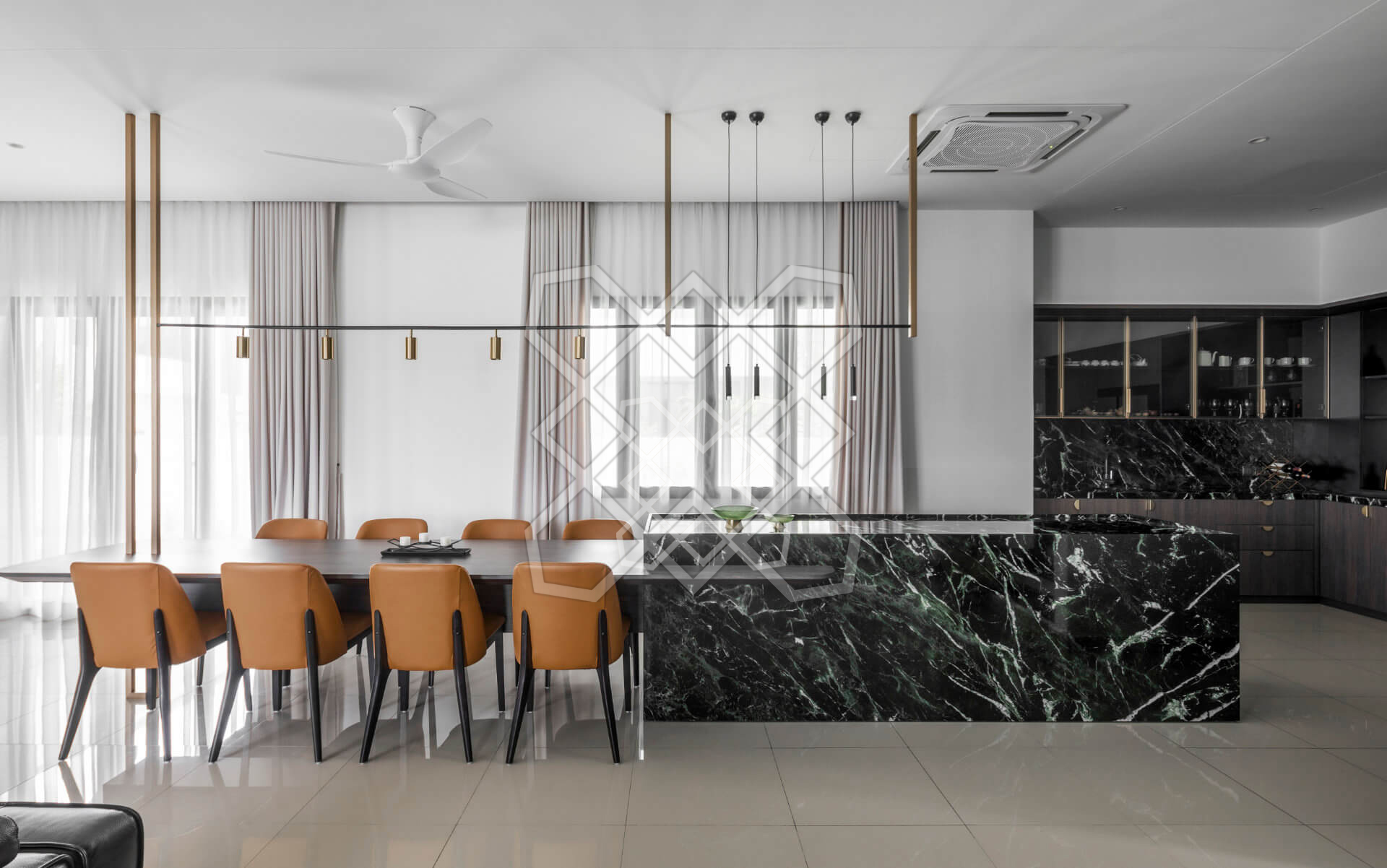 The dining table and green marble counter at Plush Contemporary House