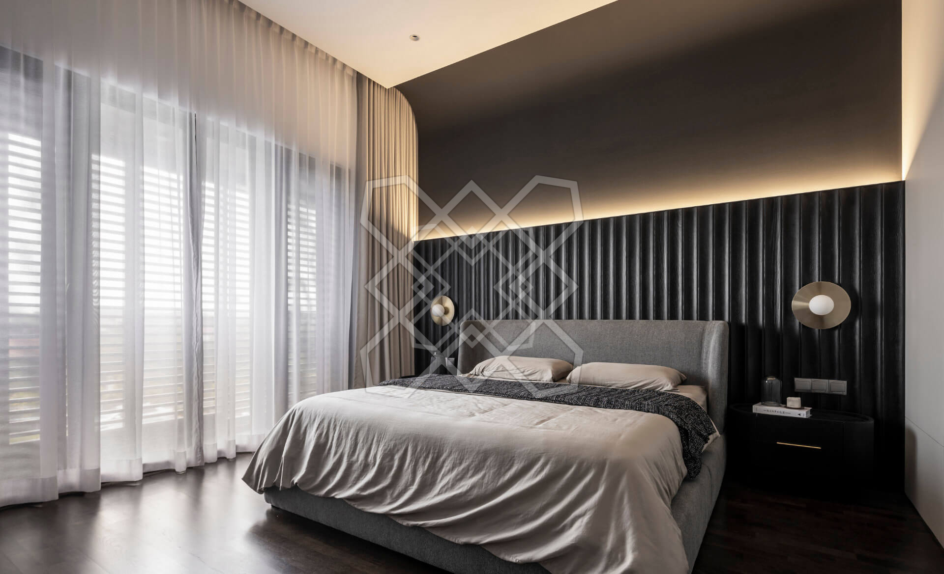 The main bedroom at Plush Contemporary House, its fluted wall under a lit cove