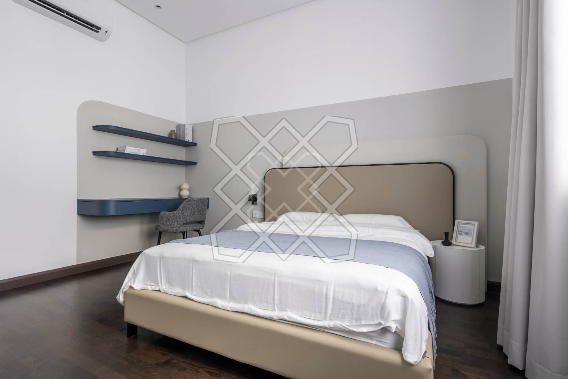A bedroom at Plush Contemporary House, with its blue floating desk