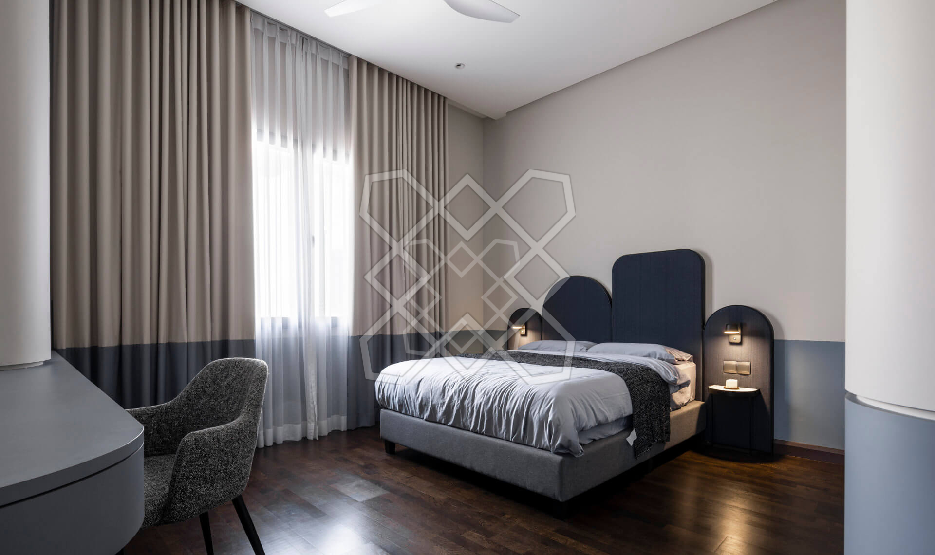A bedroom at Plush Contemporary House, with its scalloped blue headboard