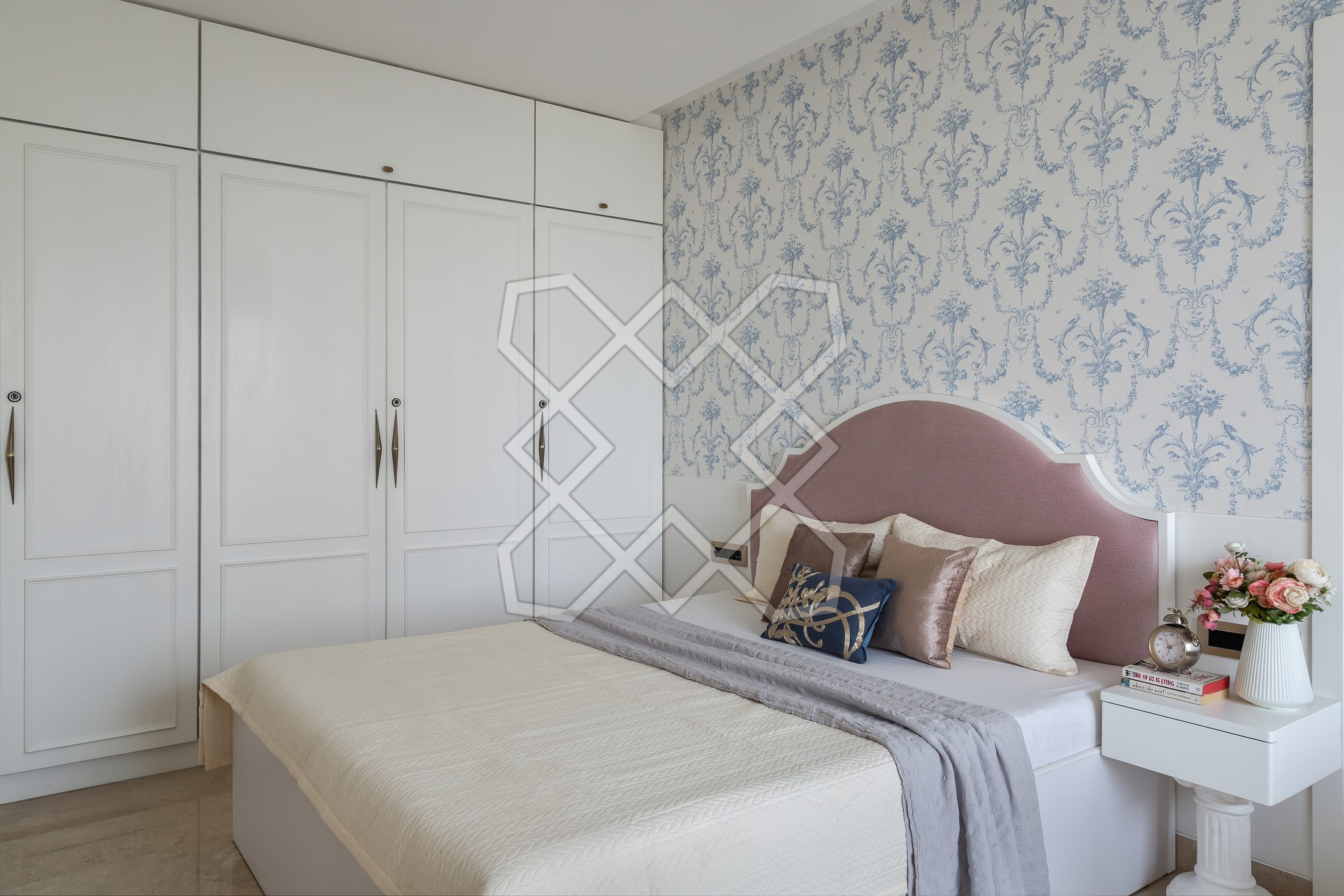 A bedroom at The Eternal Solace, with its damask wallpaper