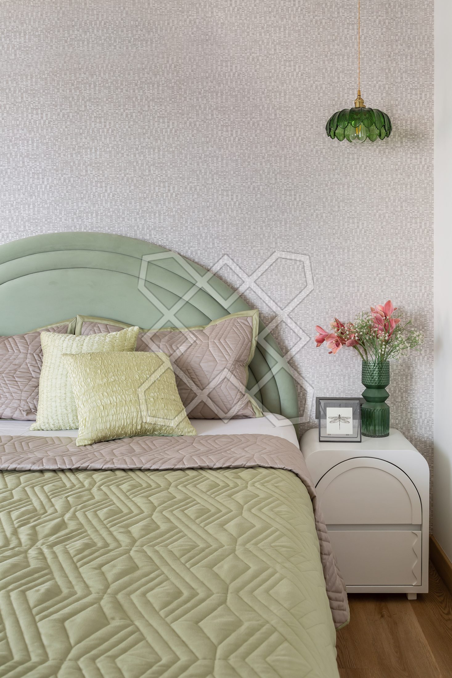 The arched sage headboard in a bedroom at The Eternal Solace