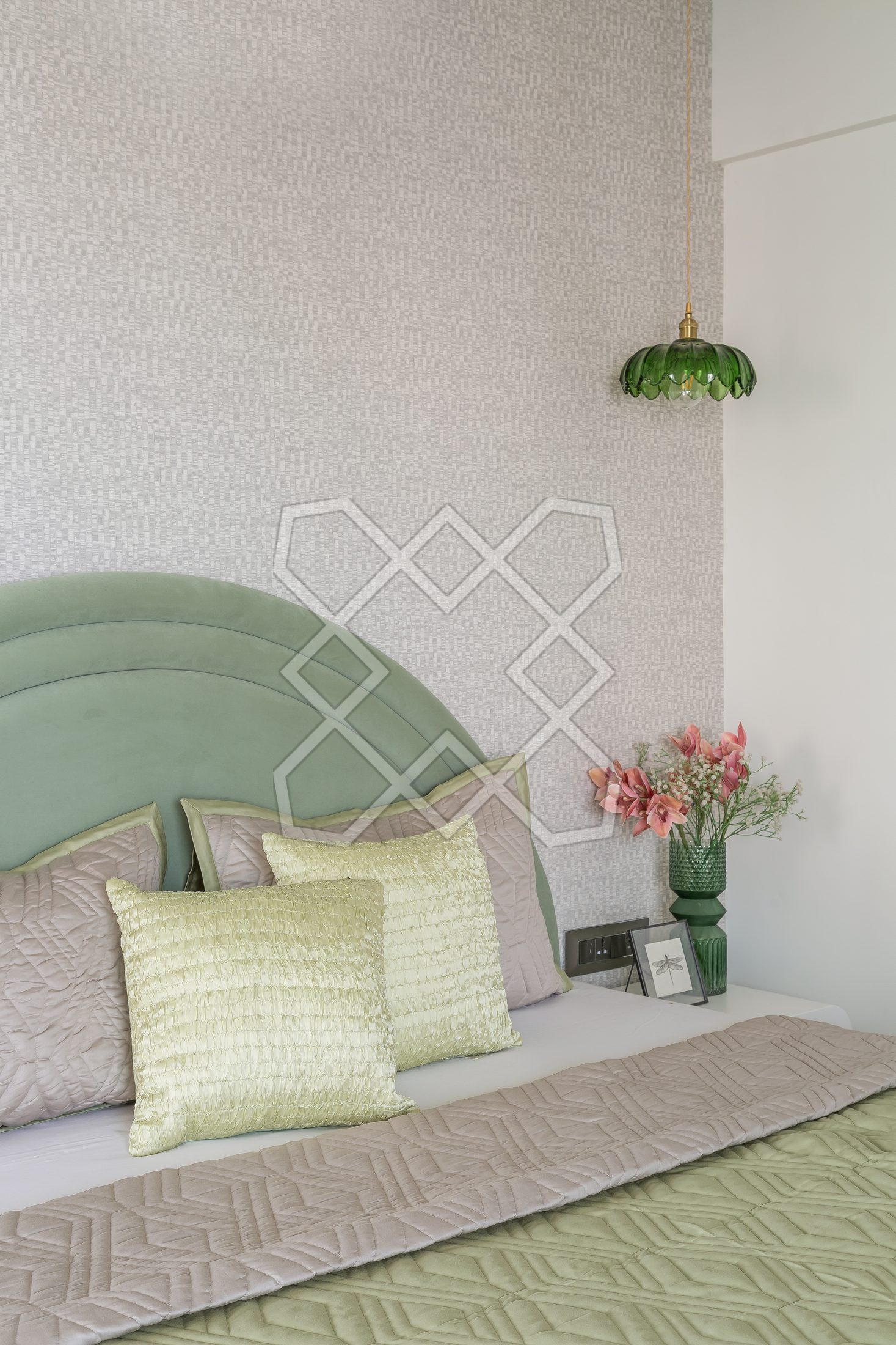 A bedroom at The Eternal Solace, with its pendant light