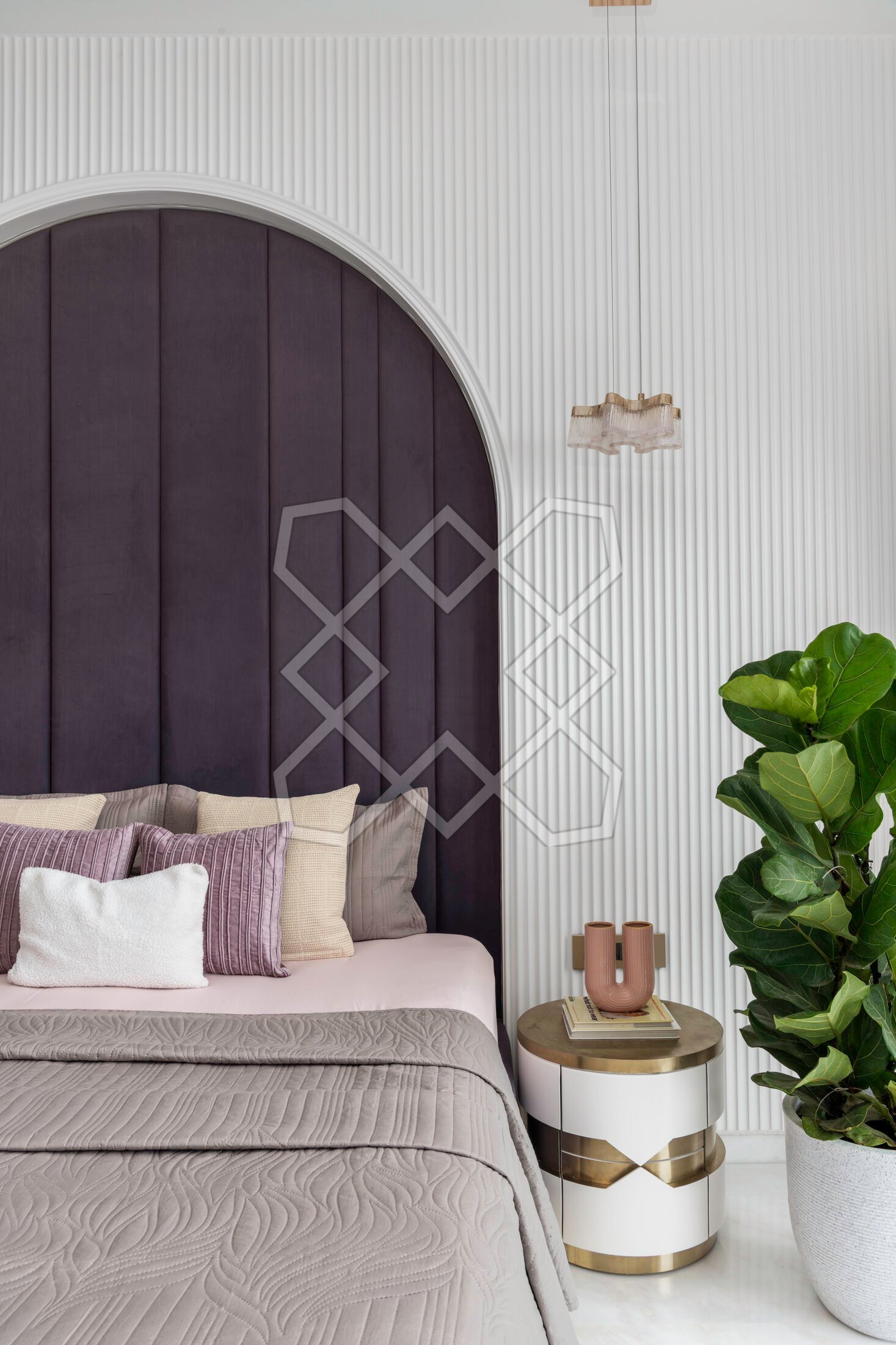A bedroom at A Still Summit, with its arched bedback