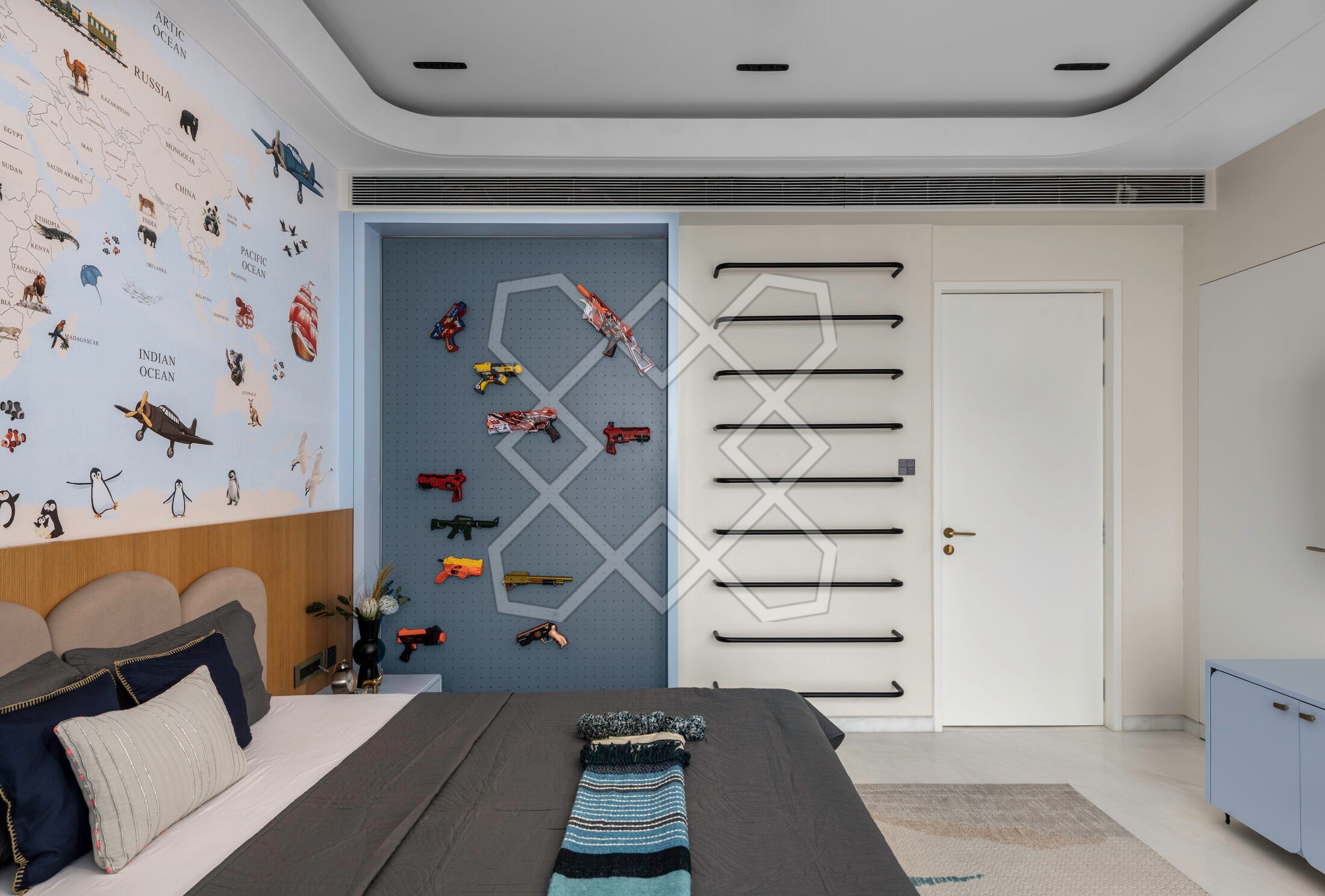 The son's room at A Still Summit, with its display wall and climbing wall