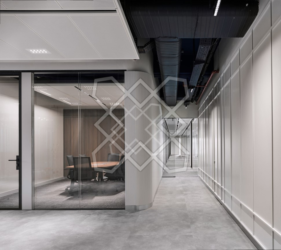 A glazed meeting room at Timeless and Transcendent, off the panelled corridor