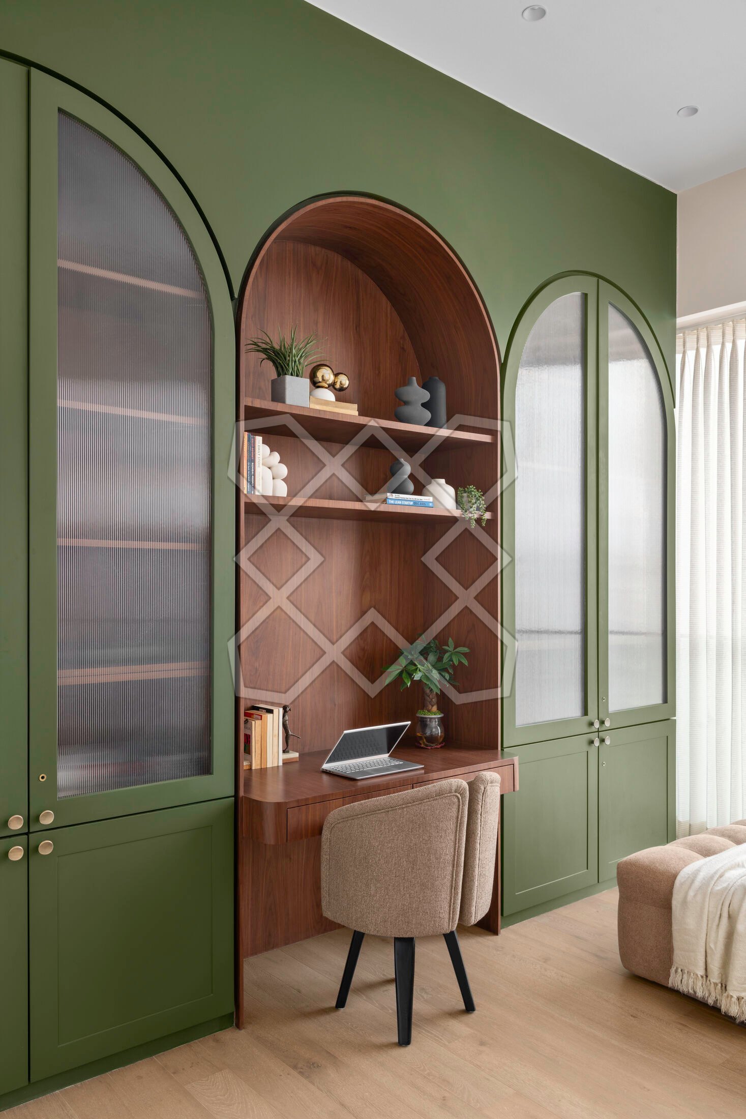The study at Vyom, in arched green joinery