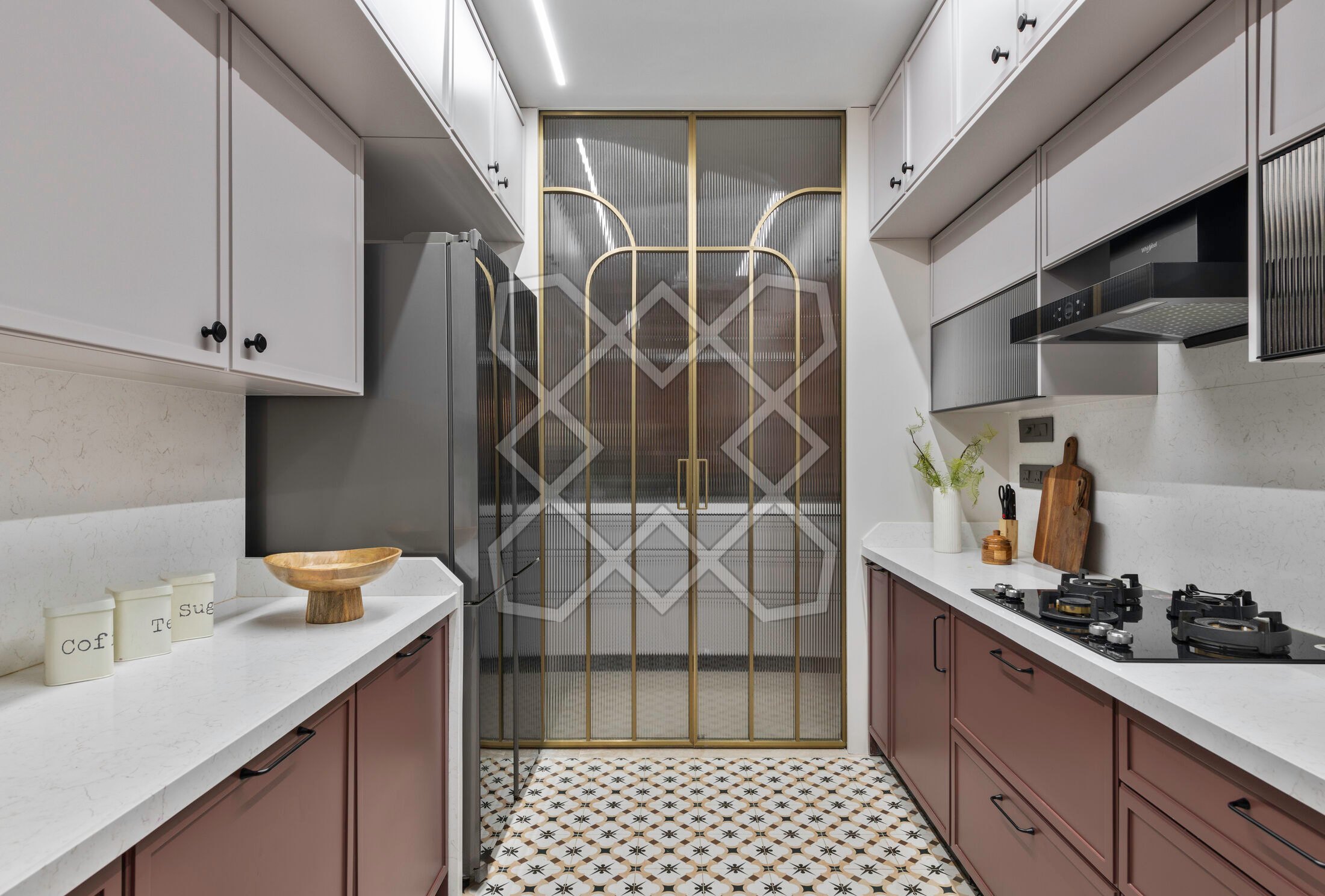 The kitchen at Vyom, behind its brass-framed glass panel