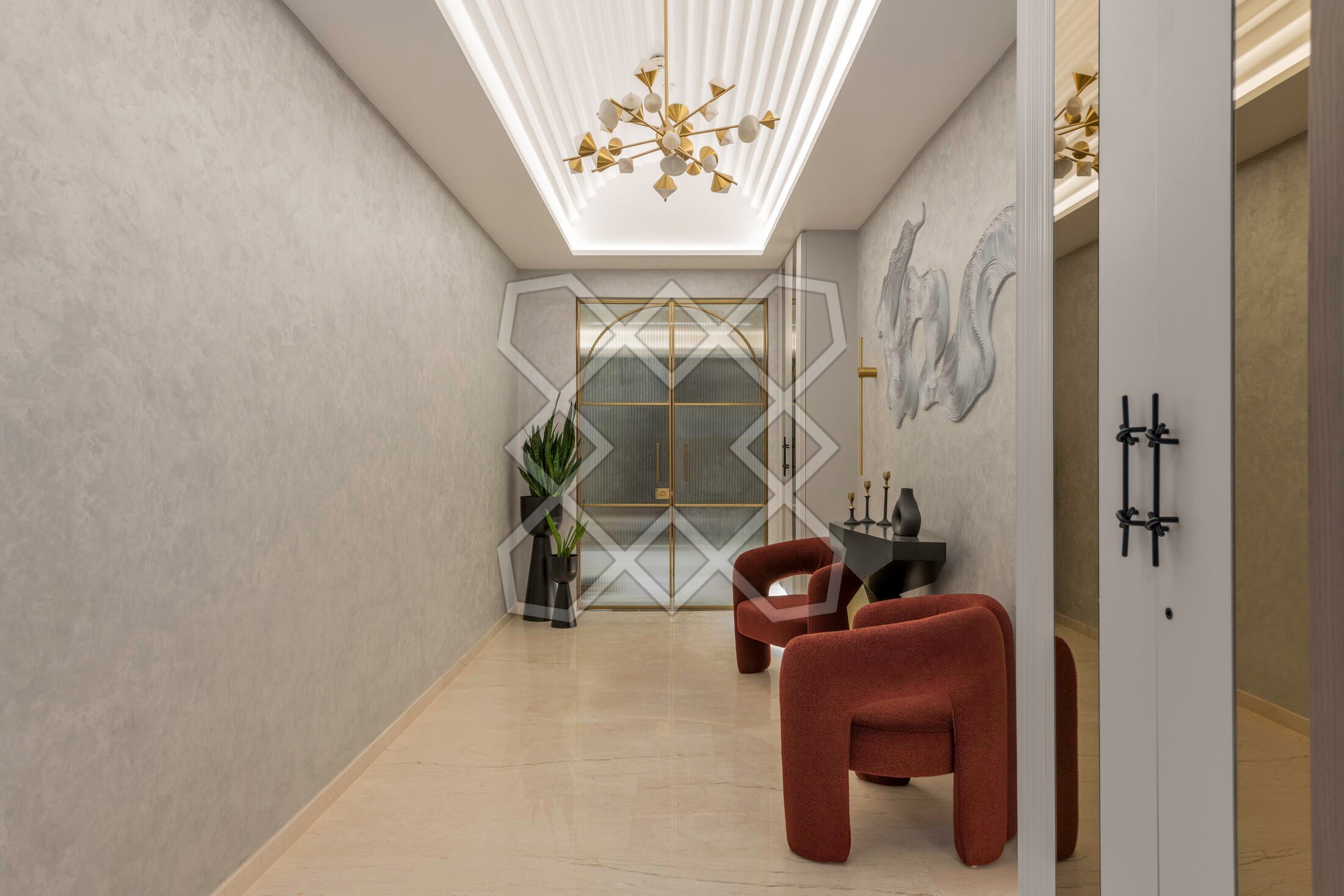 The 20-foot entryway at Vyom, with its sculptural chandelier and crimson seating